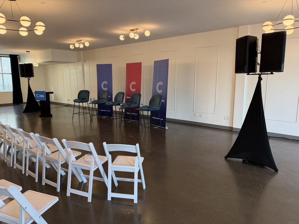 Calgary Chamber Confluence stage with branded banners and speakers